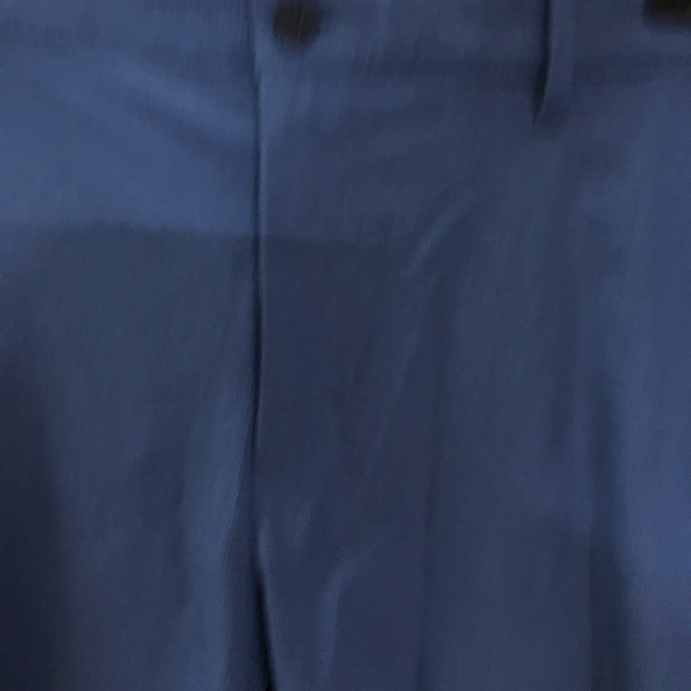 Tommy Bahama men’s short. Blue with a very slight plaid print zipper pockets